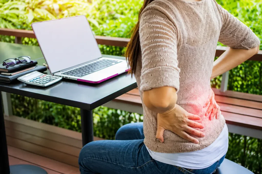 What to Expect at Your First Acupuncture Appointment 1 Woman experiencing back pain while preparing for an acupuncture appointment