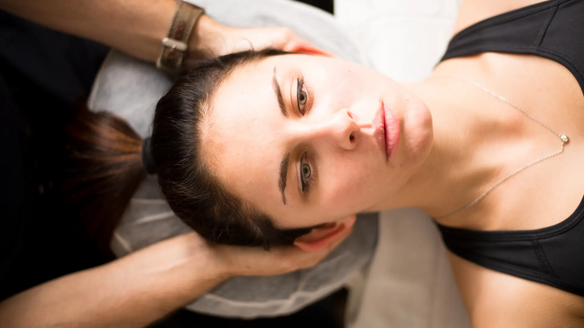 Smiling client after TMJ massage therapy session